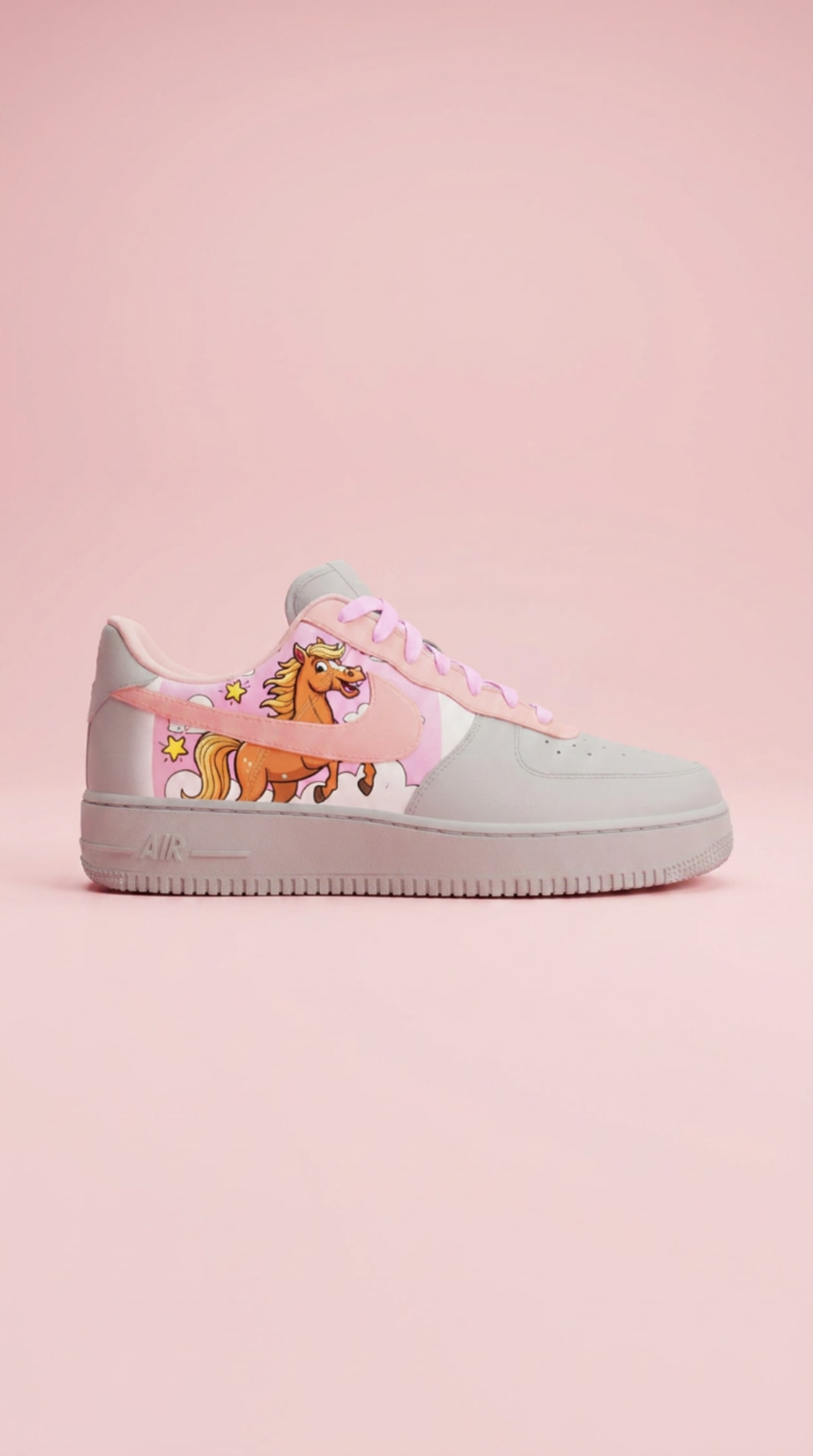 Grey and pink Air Force 1 with a cartoon pony panel on a soft pink backdrop