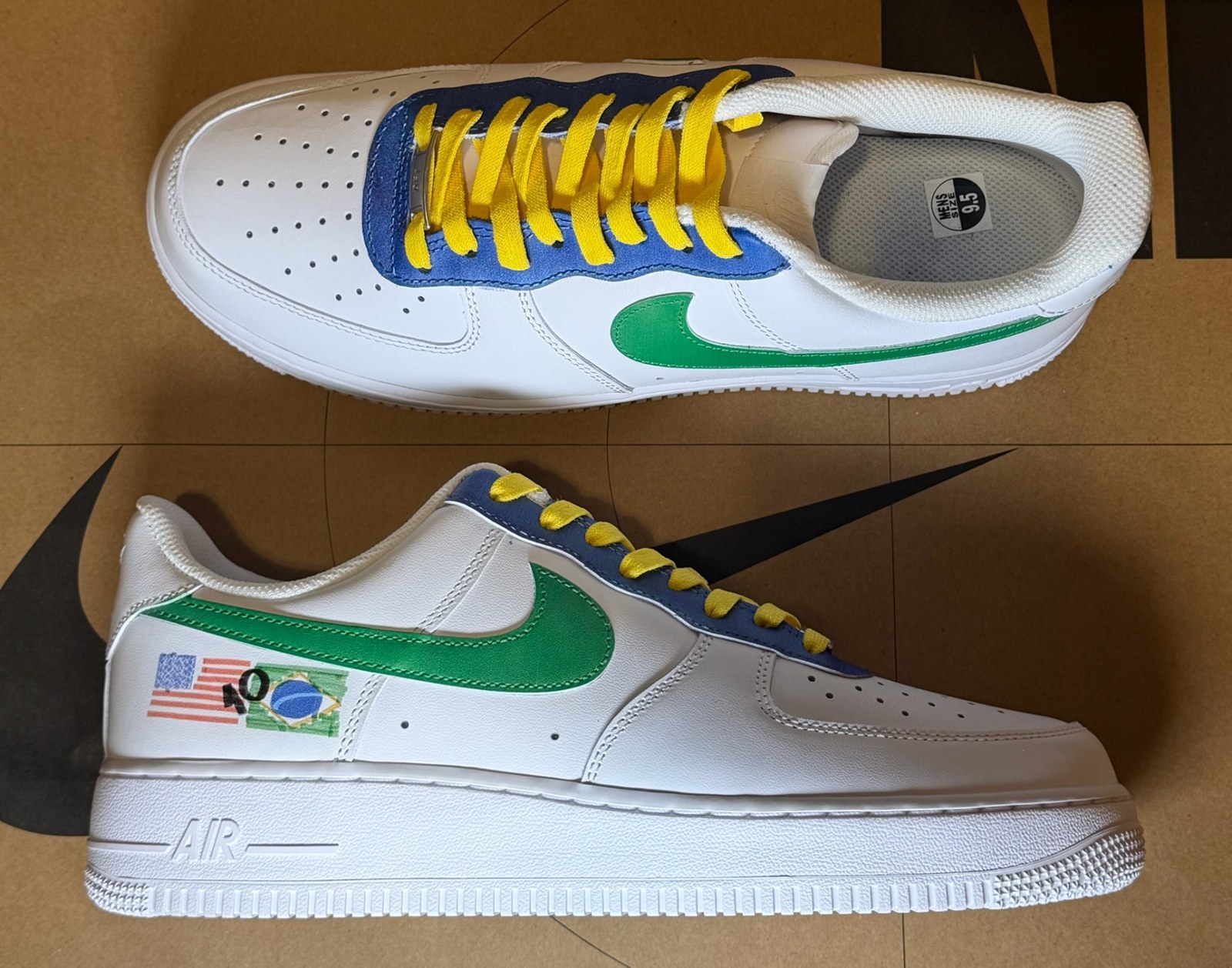 White Air Force 1 with green swoosh, yellow laces, blue eyestay and hand-painted USA and Brazil flags on the heel panel