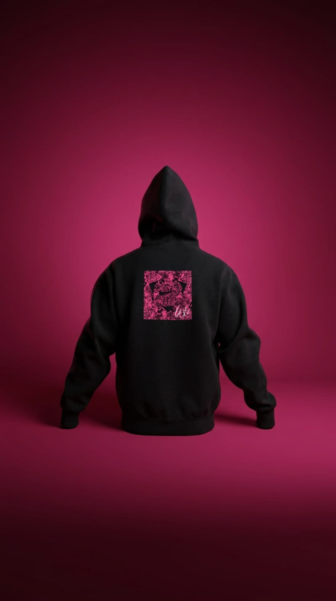 Black hoodie with a pink haze Swoosh box graphic on a magenta backdrop