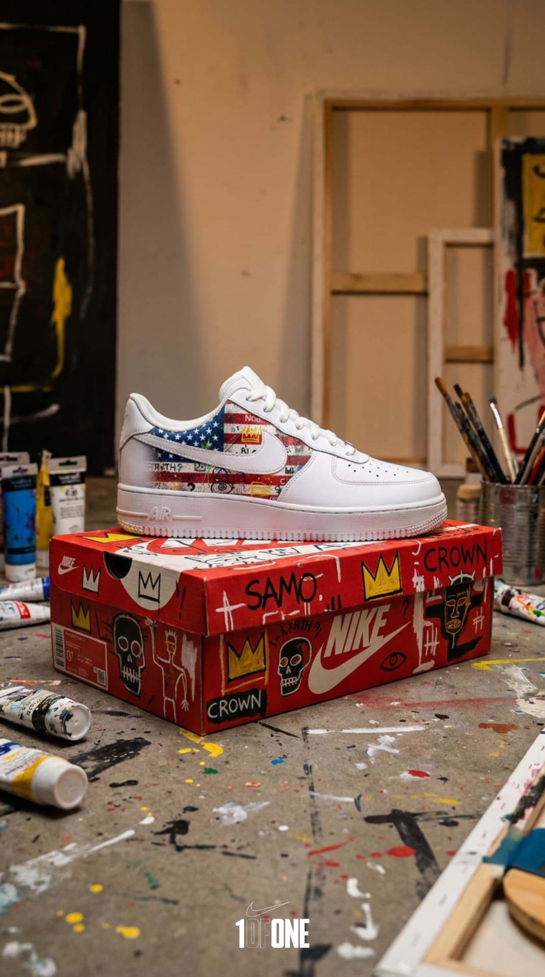White Air Force 1 with a graffiti-art American flag panel resting on a hand-painted red Nike box in an artist studio