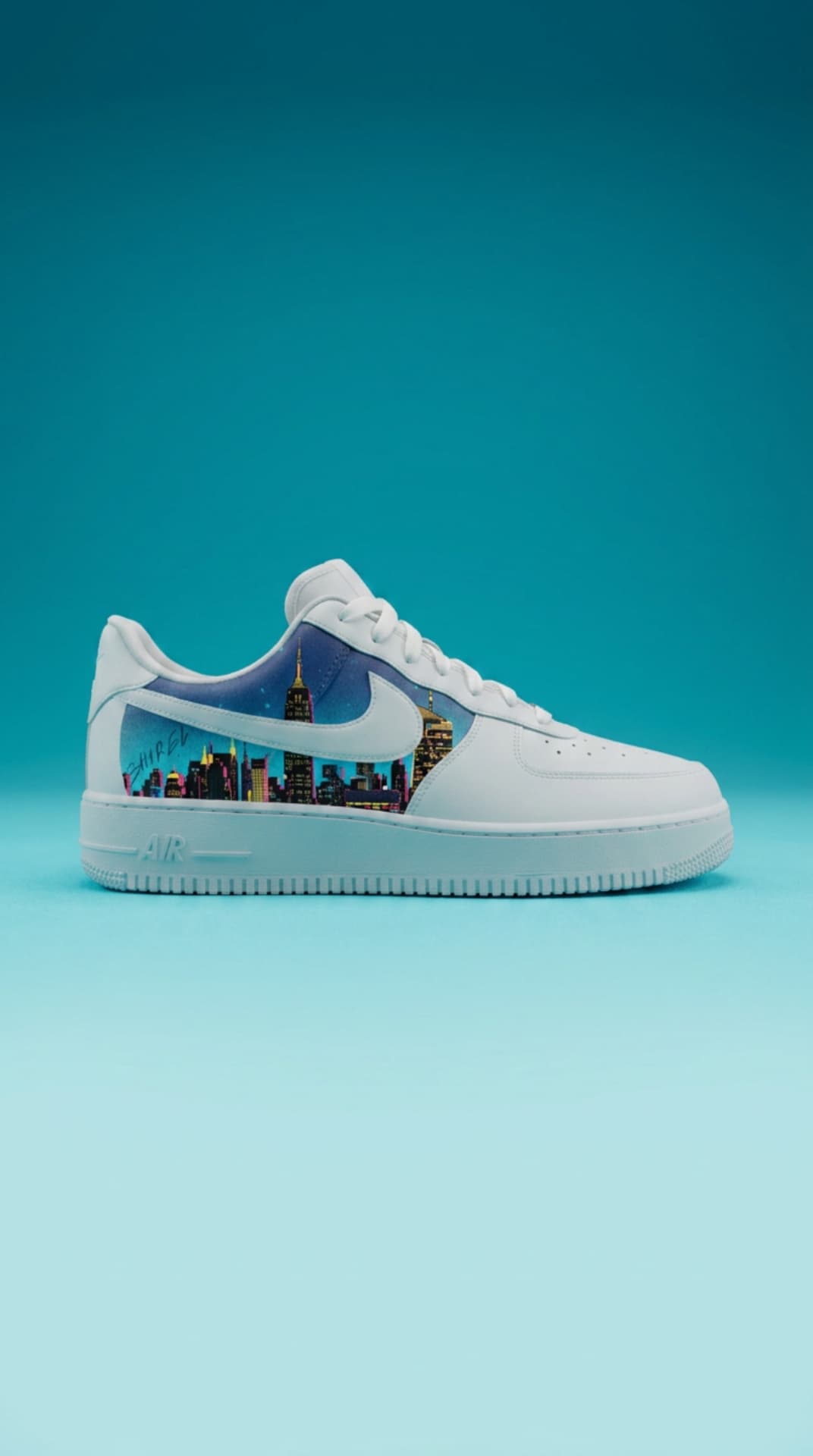 White Air Force 1 with a night-city skyline panel on a teal ocean-sky gradient backdrop