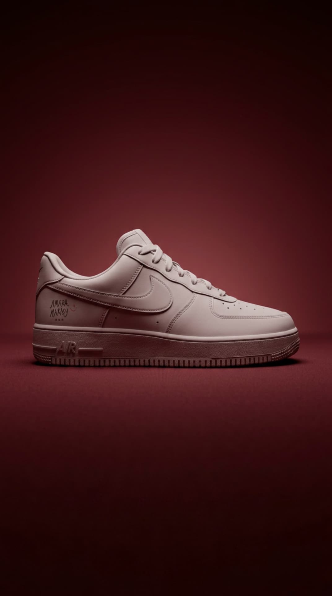 Tonal blush Air Force 1 with a hand-scripted Amara Marley signature on the heel panel against a maroon gradient set