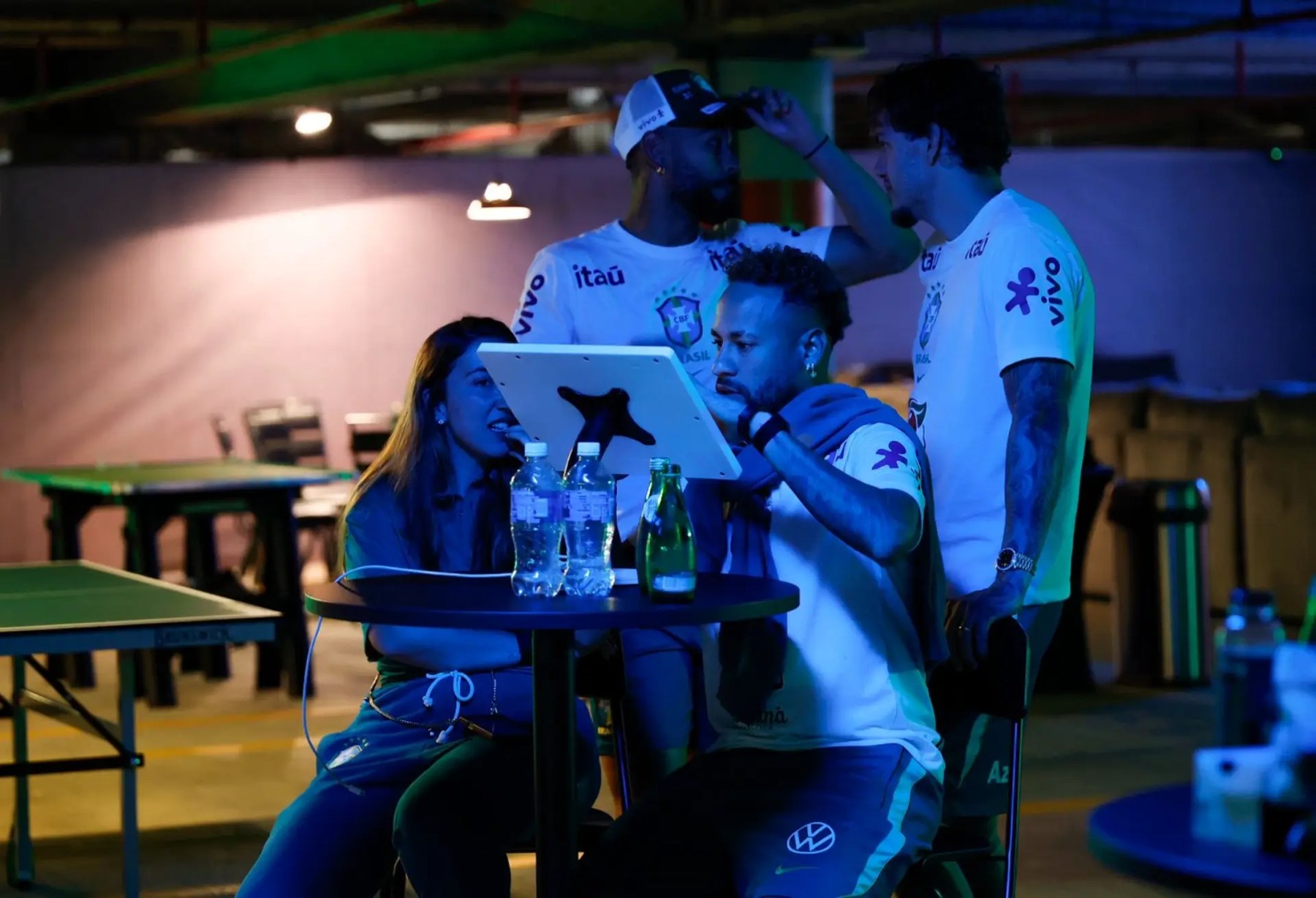 Brazil players designing their Air Force 1s on a tablet kiosk with a stylist at the activation