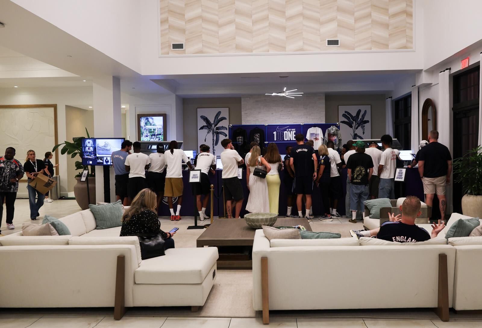 England players and guests at the 1ofONE design stations in a hotel lounge activation