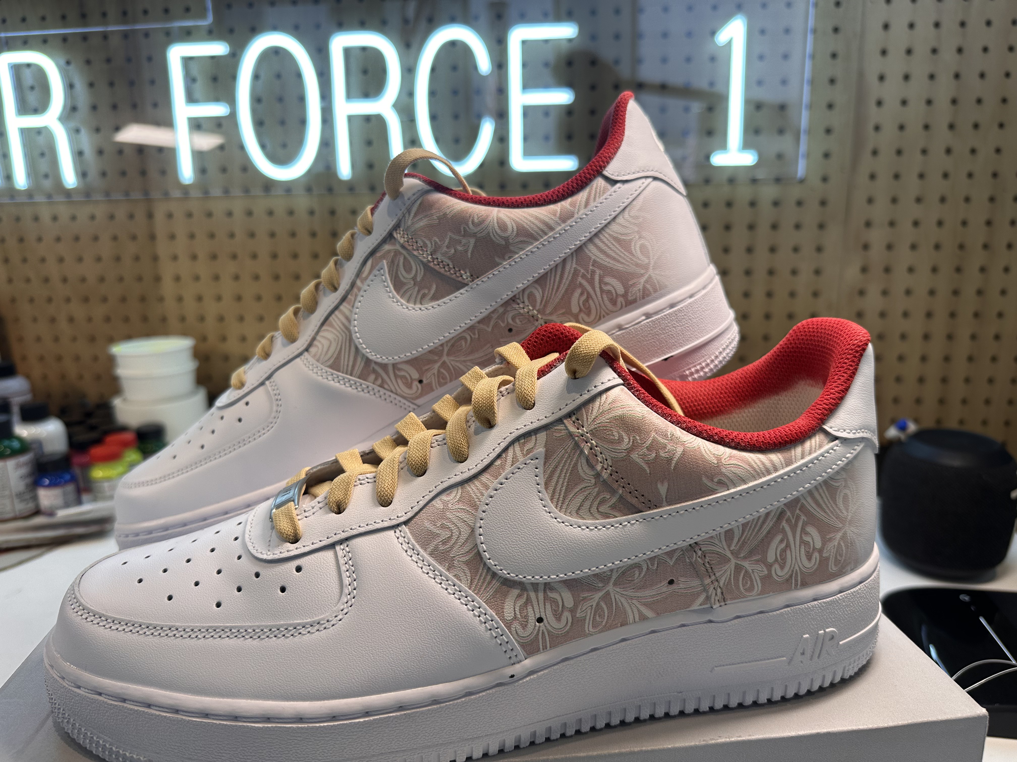White Air Force 1s with tonal paisley panels, red collar lining and tan laces